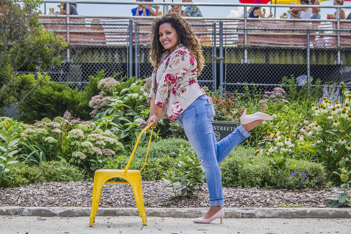 Lillian smiling with yellow chair