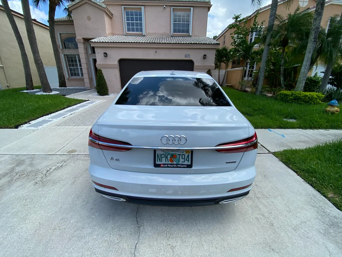 Audi A6 with fresh window tint in a South Broward driveway