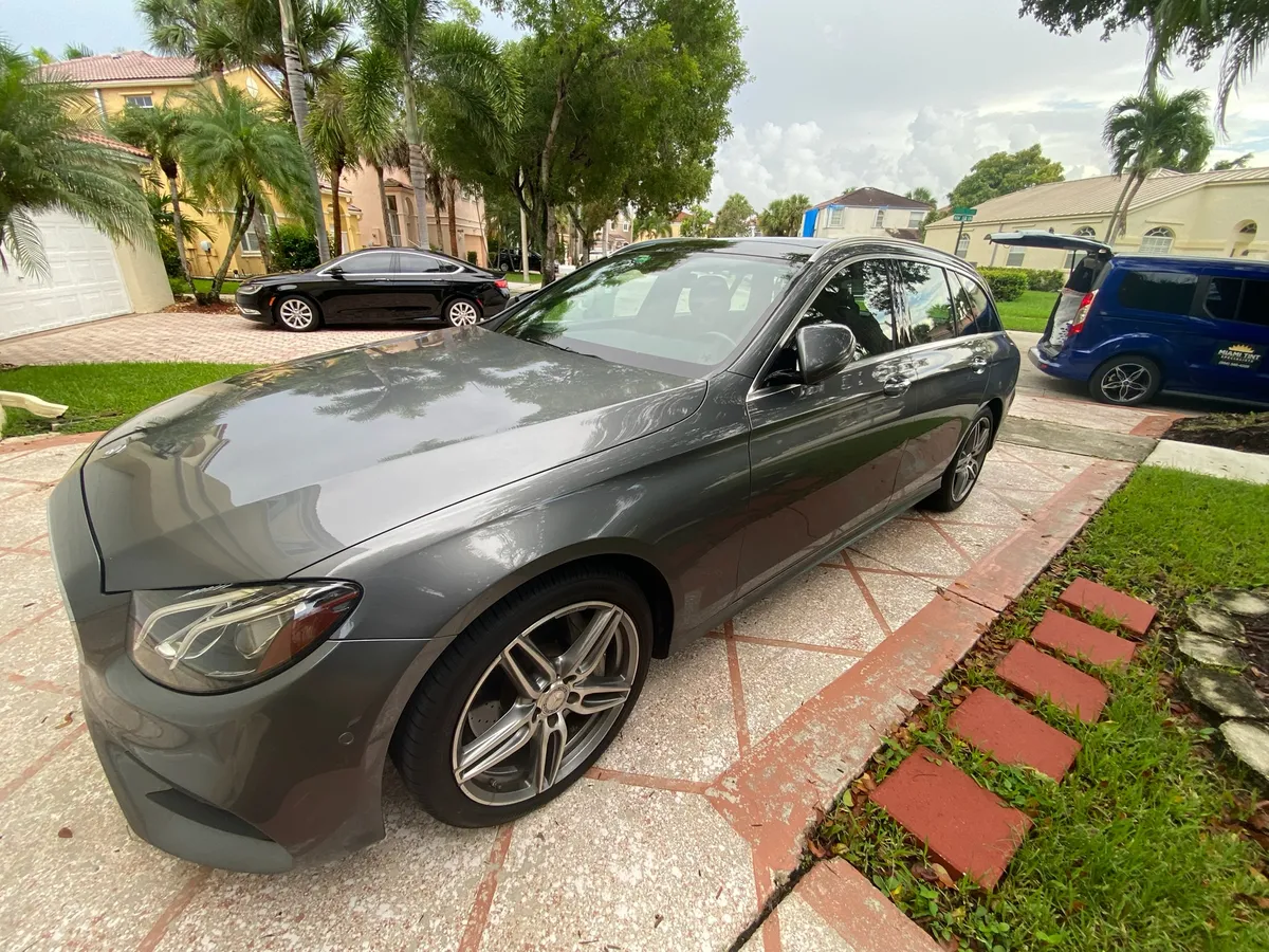 Mercedes-Benz wagon with window tint installed in a South Florida driveway