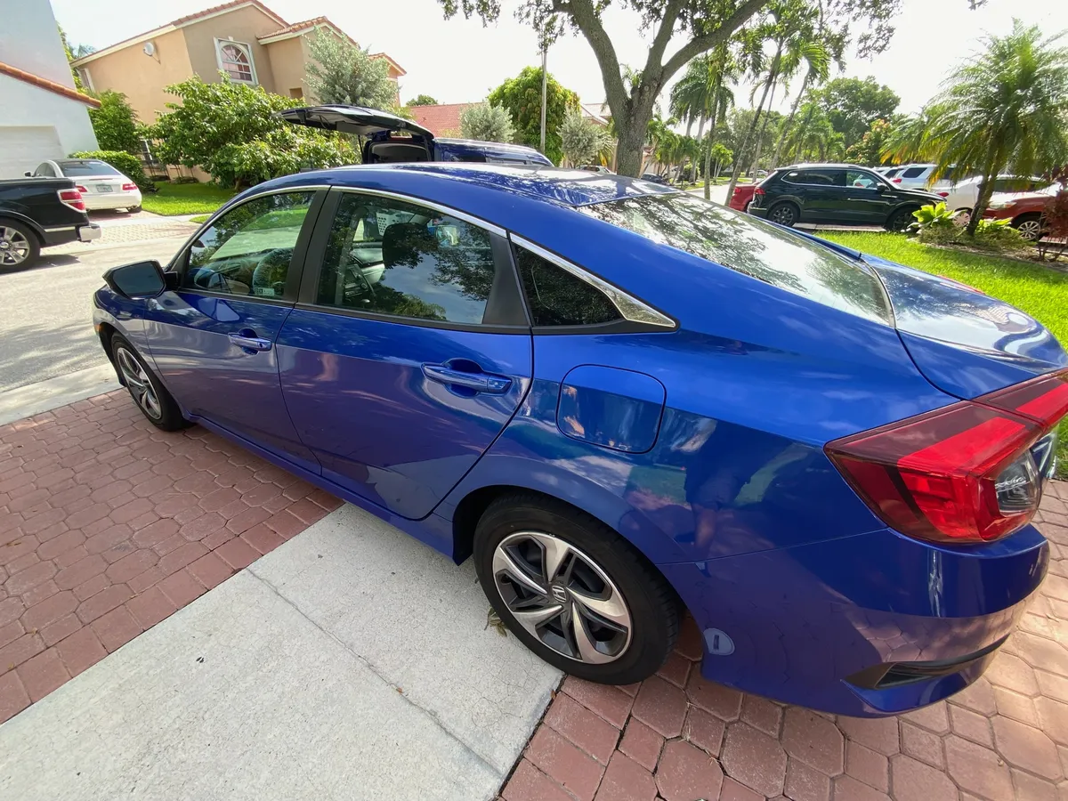 Ceramic window tint on a Honda Civic installed in a Miramar driveway