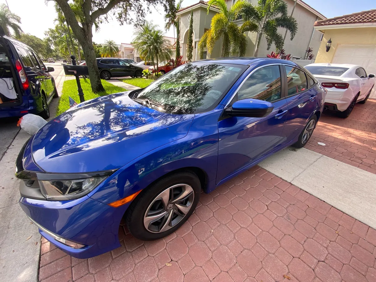 Blue Honda Civic with ceramic window tint, mobile tint job