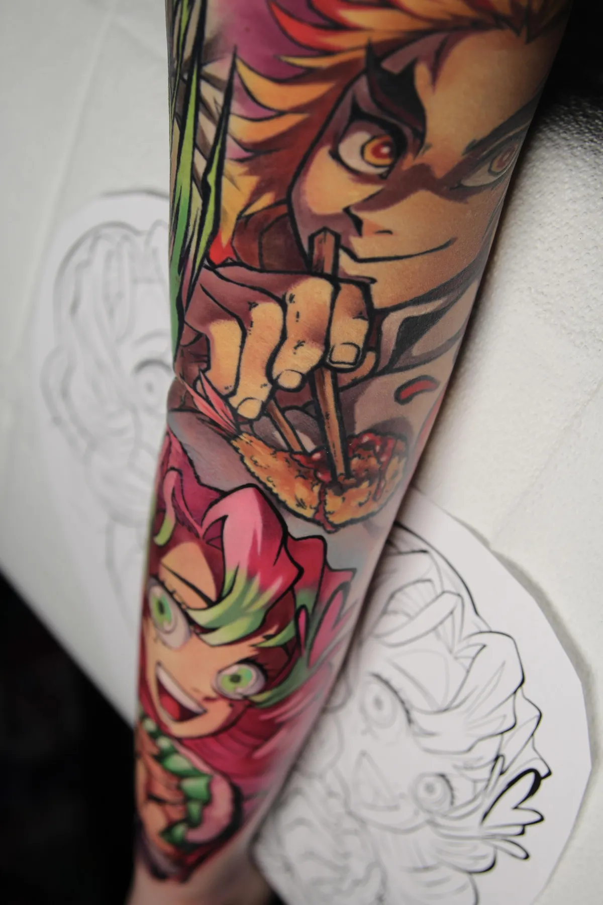 Demon Hunter tattoo sleeve of Rengoku and Mitsuri from Demon Slayer by Orlando Anime Tattoo Artist Ren Behan at xsadfamx.