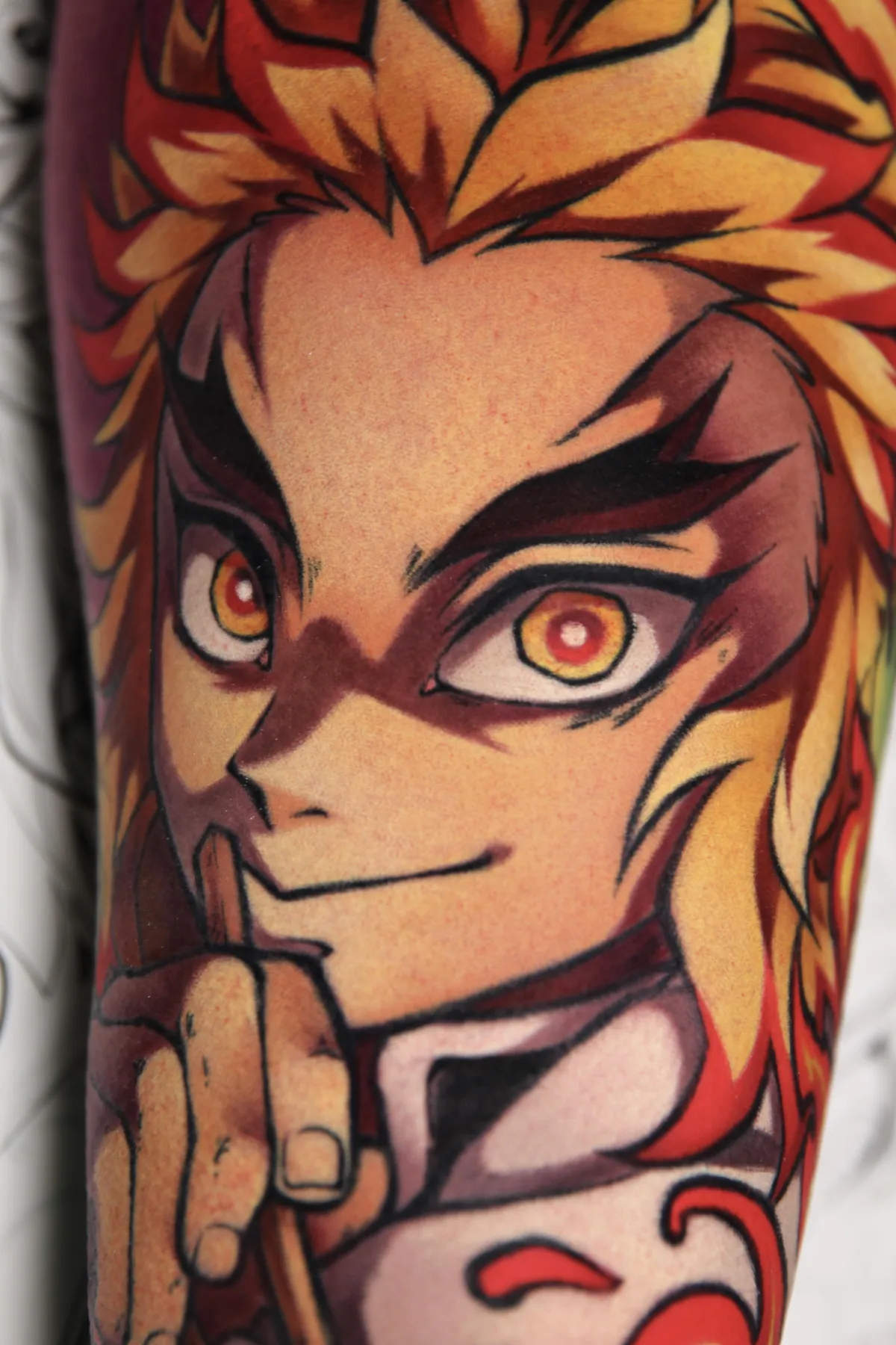 Demon Slayer tattoo of Rengoku by Orlando Anime Tattoo Artist Ren Behan at sadfam.