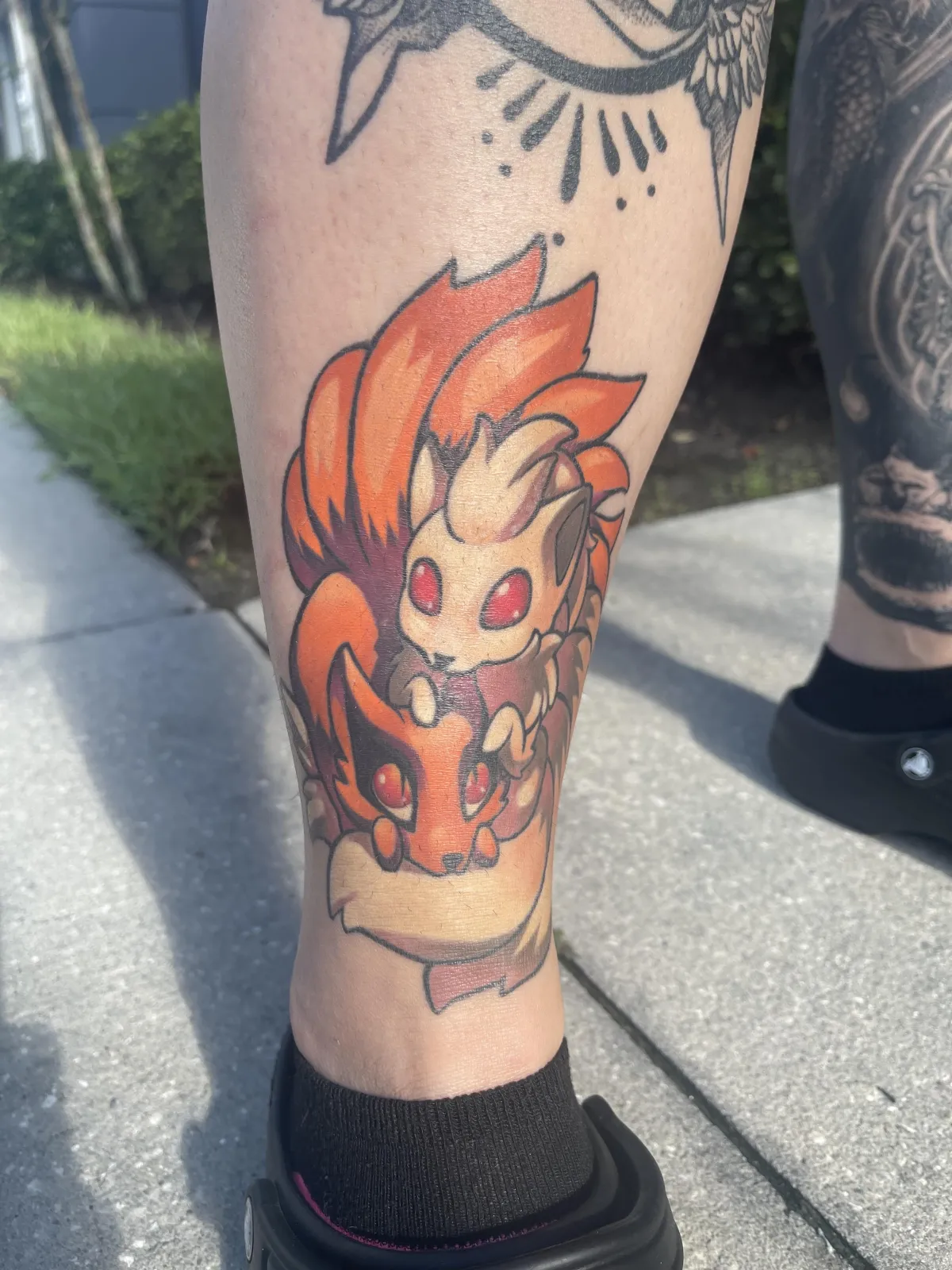 Fully healed anime tattoo of Kurama from Naruto and the Nine Tails from Pokémon by Orlando Anime Tattoo Artist Ren Behan.
