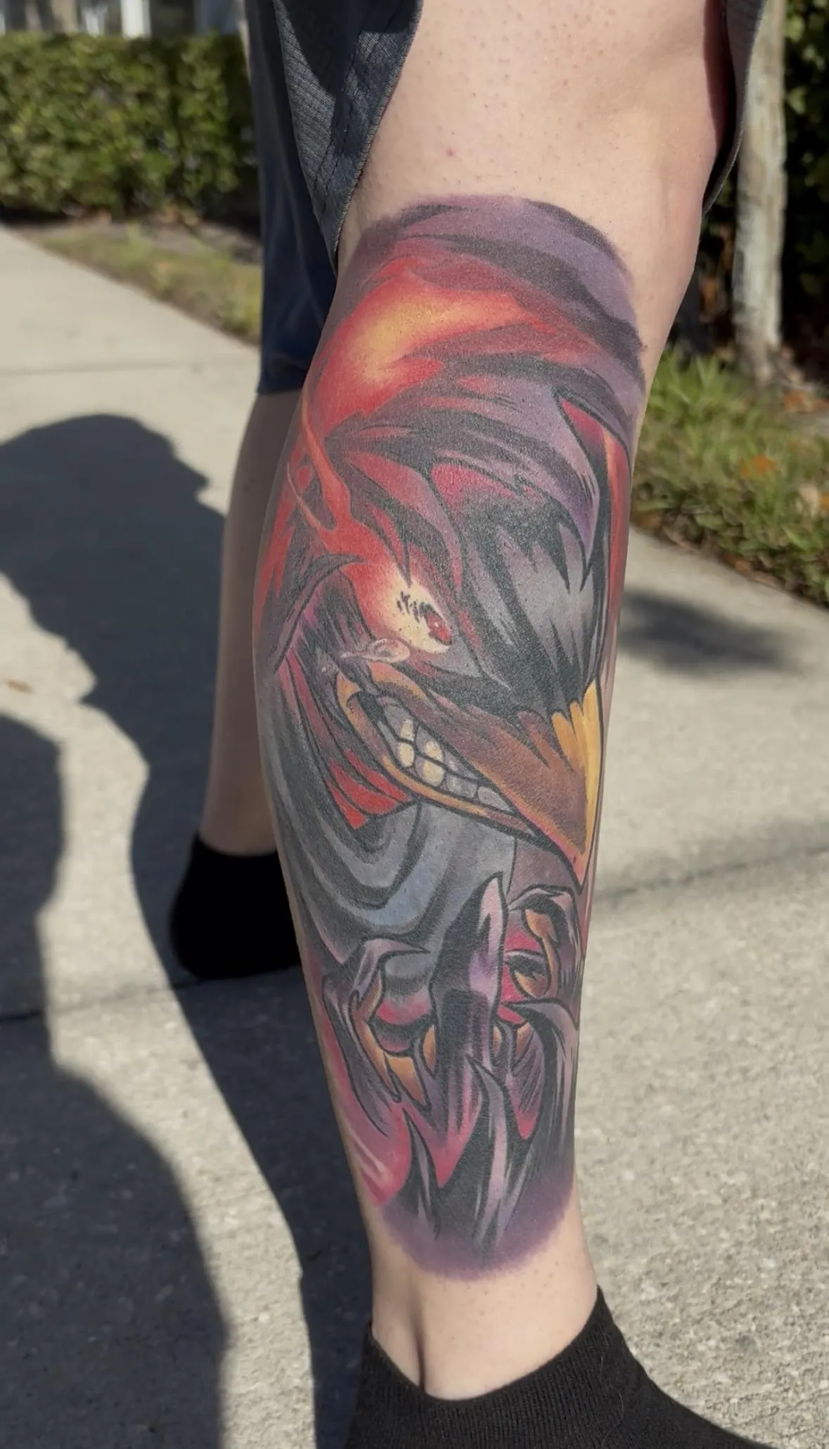 Fully healed anime tattoo of Tokoyami from My Hero Academia by Orlando Anime Tattoo Artist Ren Behan. This My Hero Academia tattoo is a coverup, and Tokoyami with his Dark Shadow was the perfect duo to cover unwanted old ink.