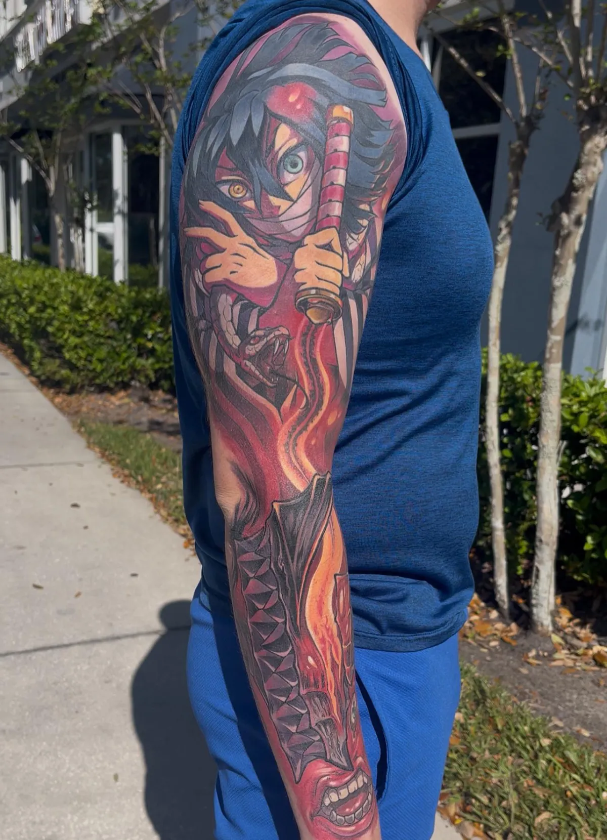 Fully healed anime tattoo of Obanai and Berserk in a mash up by Orlando Anime Tattoo Artist Ren Behan. This outer sleeve remains rich in color and visually striking in composition.