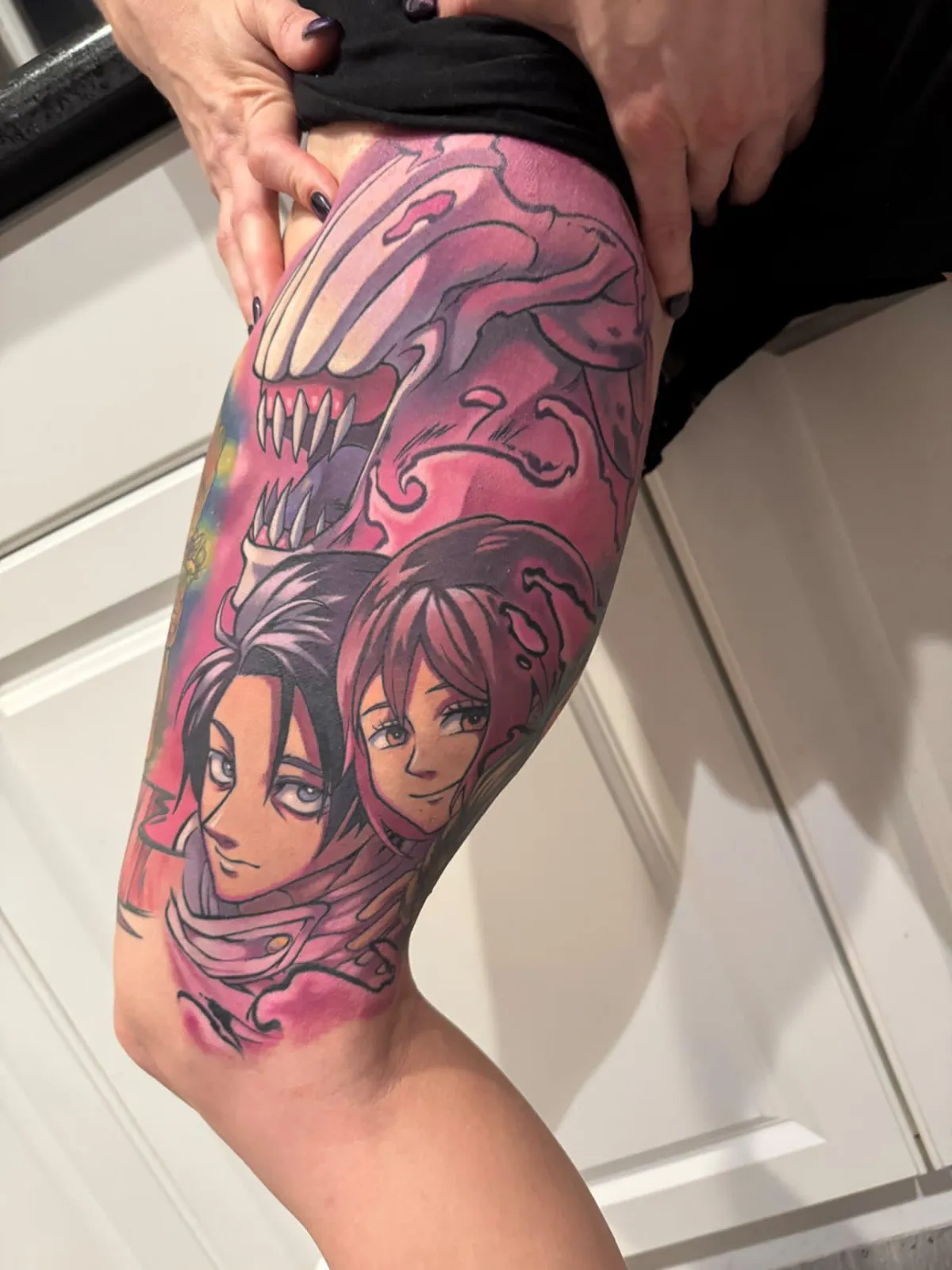 Fully healed anime tattoo of Yuta and Rika from JJK. This Large inner thigh tattoo has many variations of pink and purple with sharp details.
