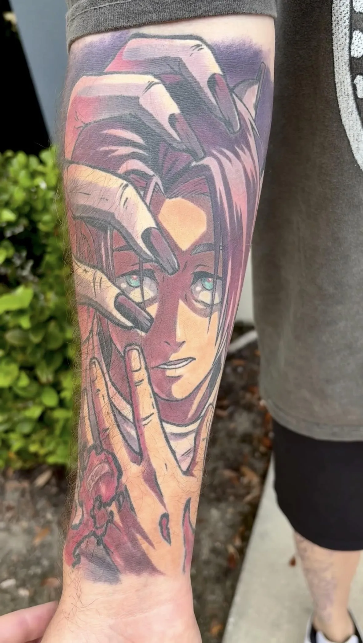 Fully healed anime tattoo of Yuta from JJK by Orlando Anime Tattoo Artist Ren Behan. The composition of this JJK tattoo features Rika's hand over Yuta as he summons her cursed energy.