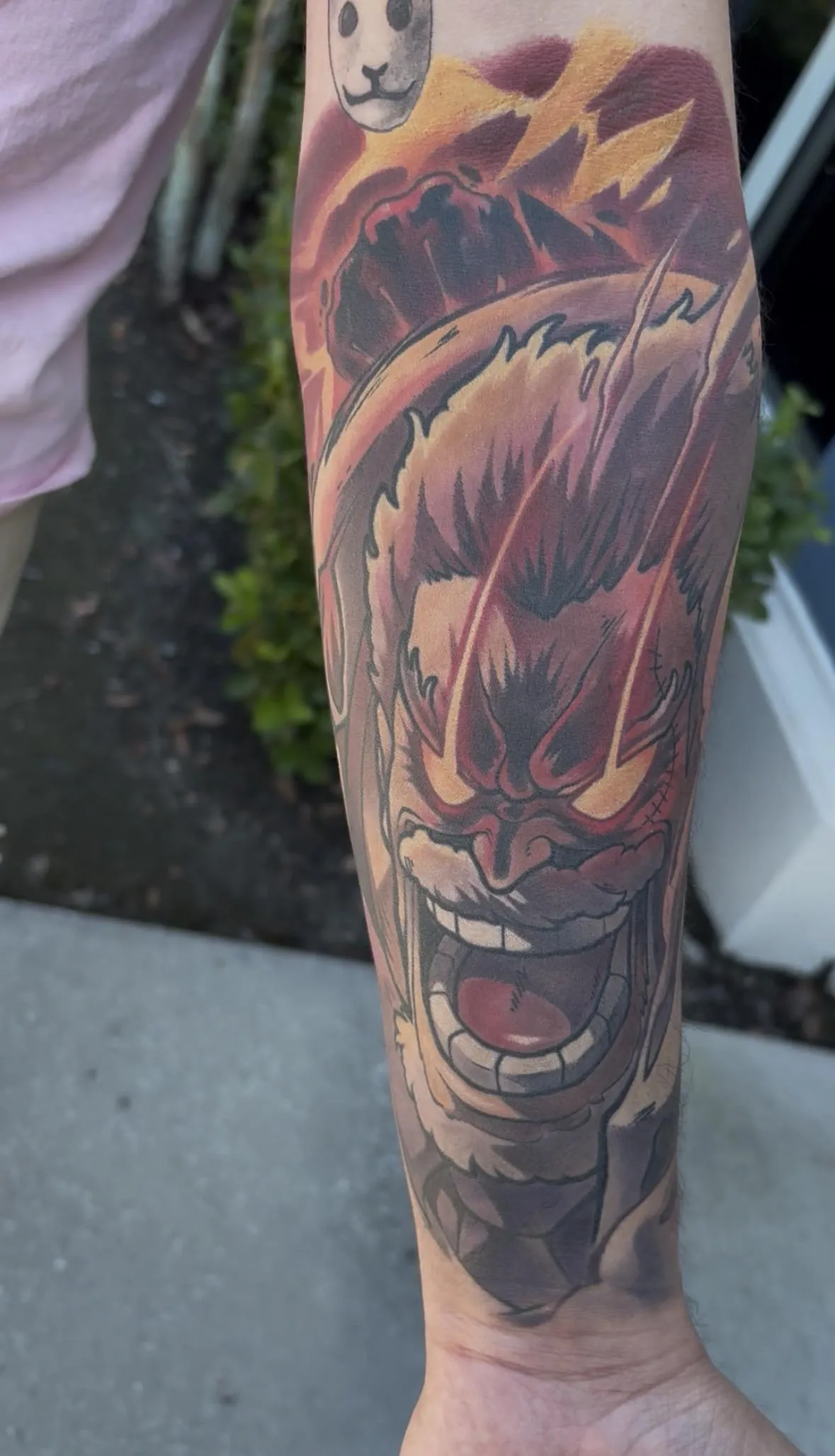 Fully healed anime tattoo of Garp from One Piece by Orlando Anime Tattoo Artist Ren Behan. This One Piece Tattoo features Garp's iconic Galaxy impact attack in a high contrast color composition.
