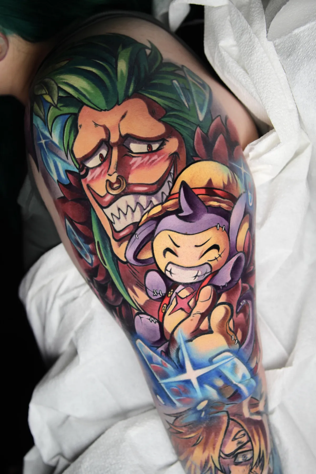 Large One Piece Tattoo of Bartolomeo and a Luffy Aipom by Orlando anime tattoo artist Ren Behan. This Bartolomeo tattoo and Pokémon tattoo represent the commitment to being a true straw hat pirate fan, and their greatest supporter.