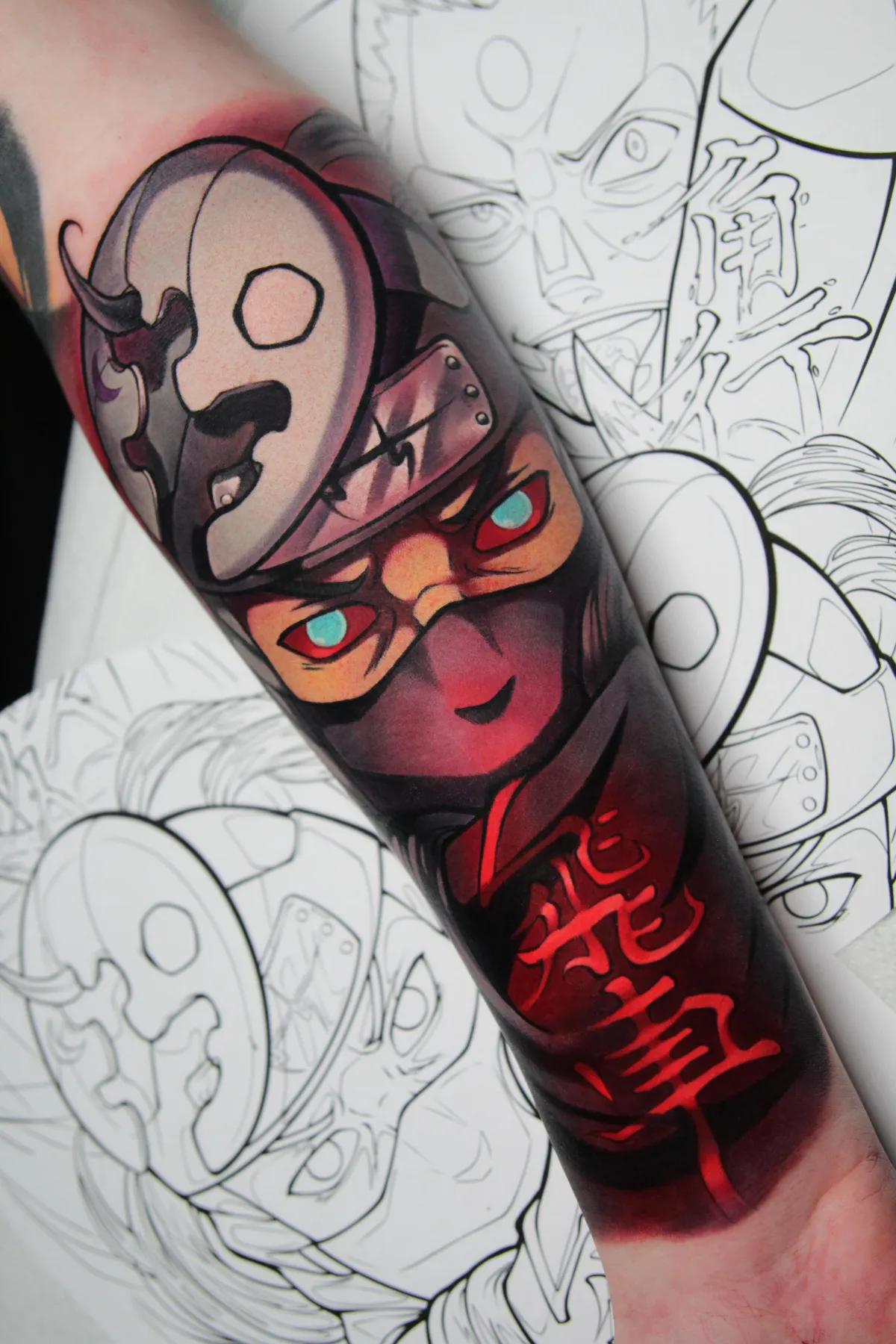 This anime forearm tattoo is of Kakuzu from from Naruto by Orlando, Florida anime tattoo artist Ren Behan. This anime portrait of Kakuzu features the kanji for bishop, which fans believe represents his role perfectly in the game of Shoji.