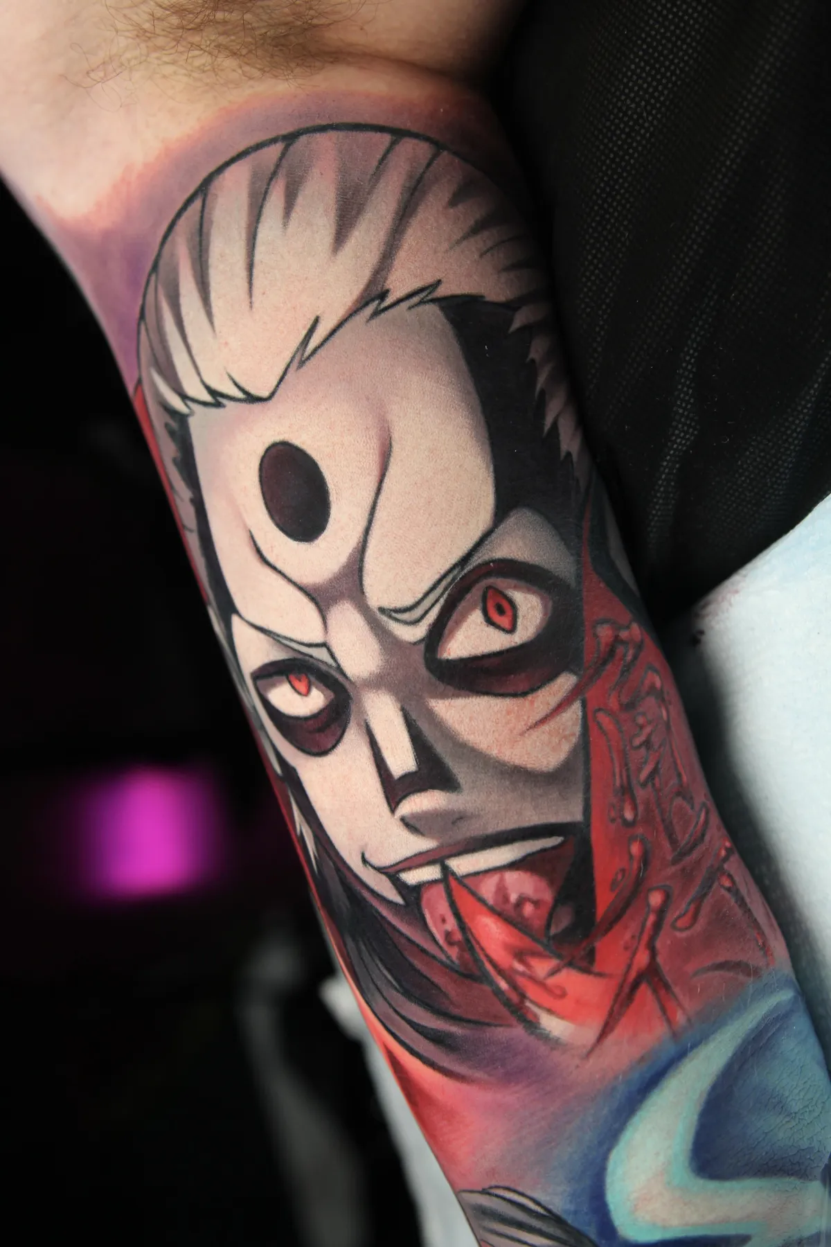 Inner arm Naruto tattoo of Hidan by Orlando, Florida anime tattoo artist Ren Behan. This Hidan tattoo focuses on his death god form with the kanji for Rook from the game shoji - fans feel this shoji piece represents him perfectly in Shikamaru's famous revenge.