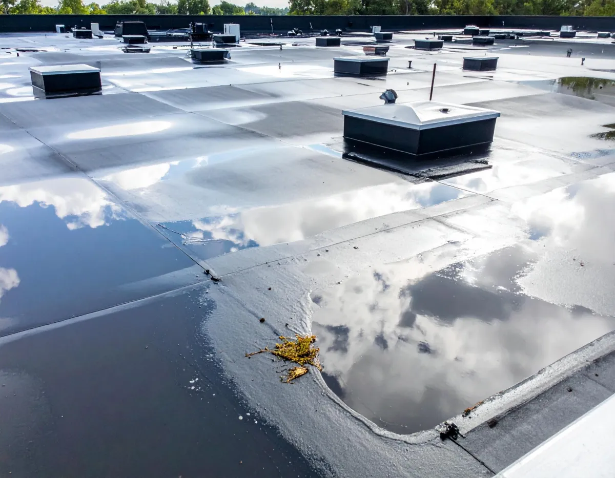 Commercial EPDM rubber roof with ponding water needing silicone coating repair in Middleburg PA