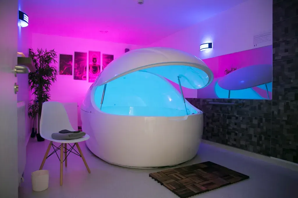 a white float spa with blue light inside