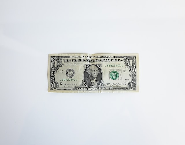 a one dollar bill on a white background