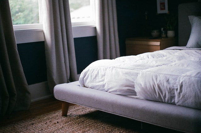 a bed with a white mattress