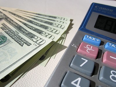 a calculator and money on a table