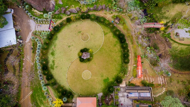 a circular lawn with a yin yang symbol