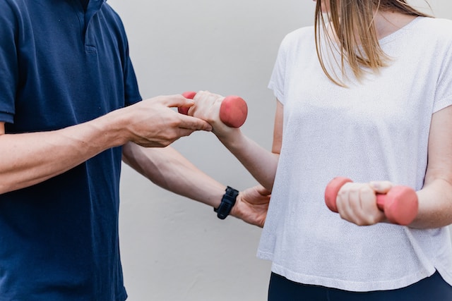 a person and person holding weights