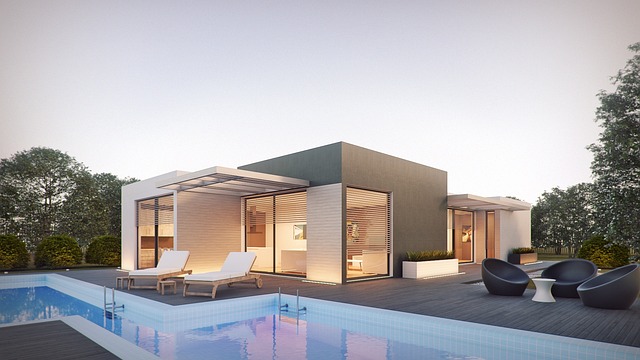 a house with a pool and lounge chairs