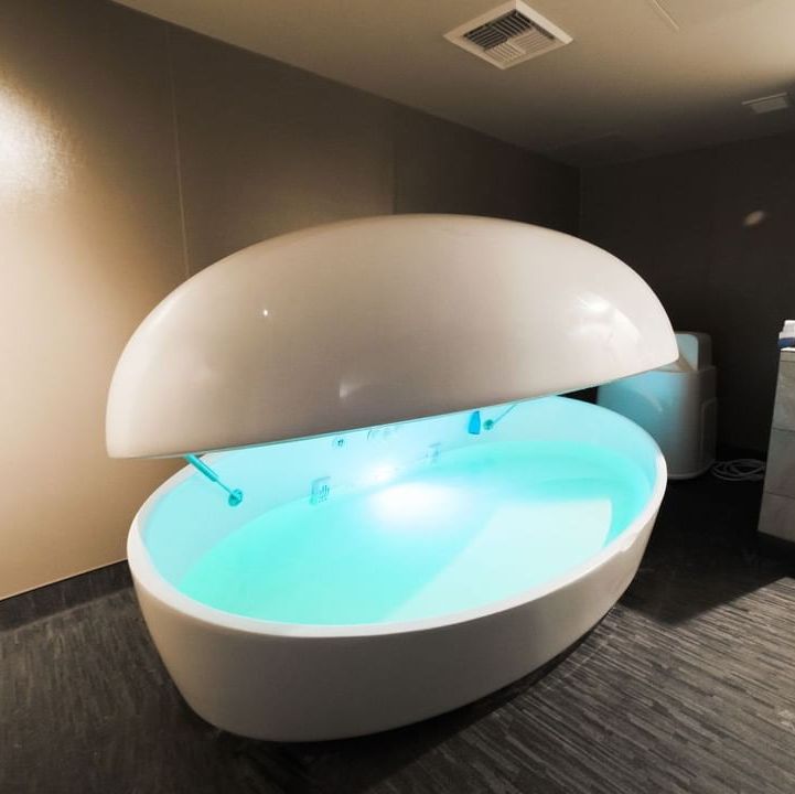 a white float spa with a blue light inside