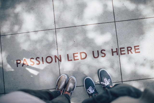 a person's feet on a tile floor with text on it