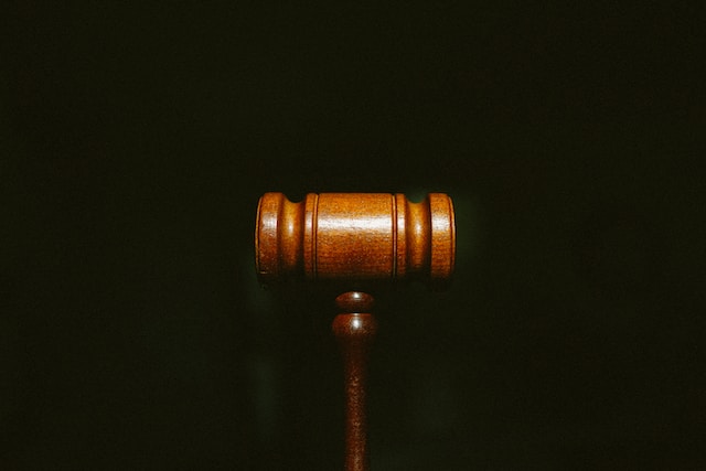 a wooden gavel on a black background