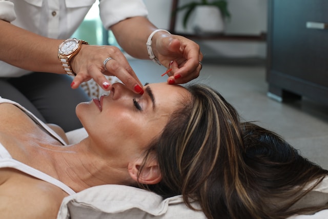 a person receiving a face massage