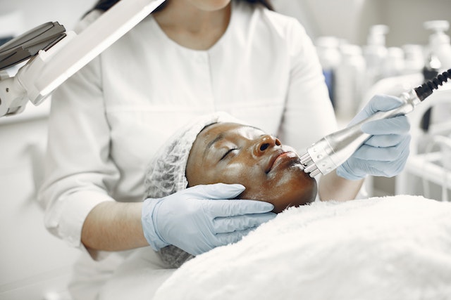 a person getting a face treatment