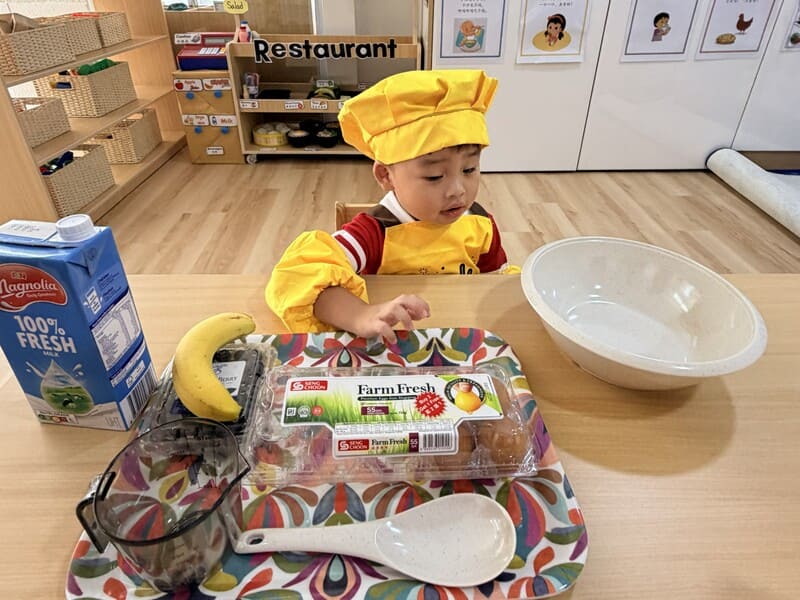 Preschool child joyfully exploring rhythmic dance and creative expression with props