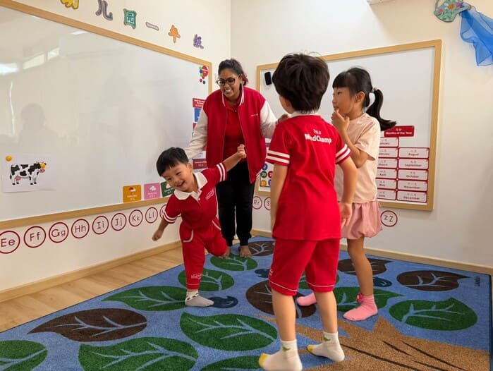 Preschool child joyfully exploring rhythmic dance and creative expression with props