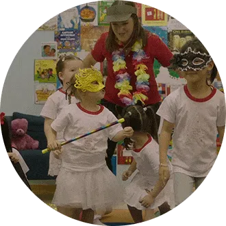 Preschool child joyfully exploring rhythmic dance and creative expression with props
