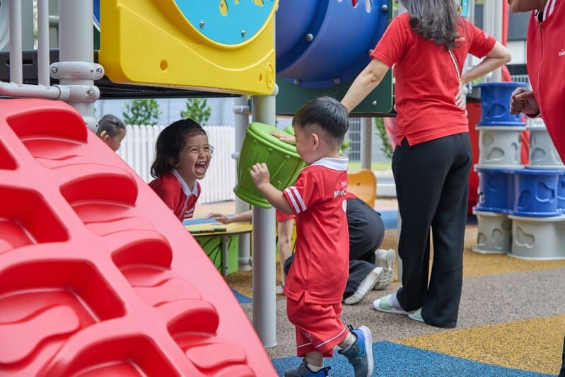 Preschool child joyfully exploring rhythmic dance and creative expression with props