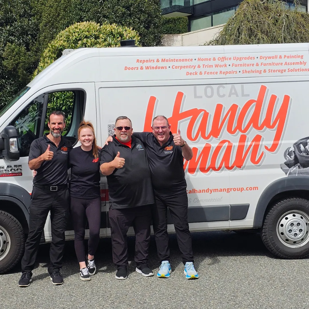 Handyman Regina franchise owners with their family in front of Local Handyman Group branding.