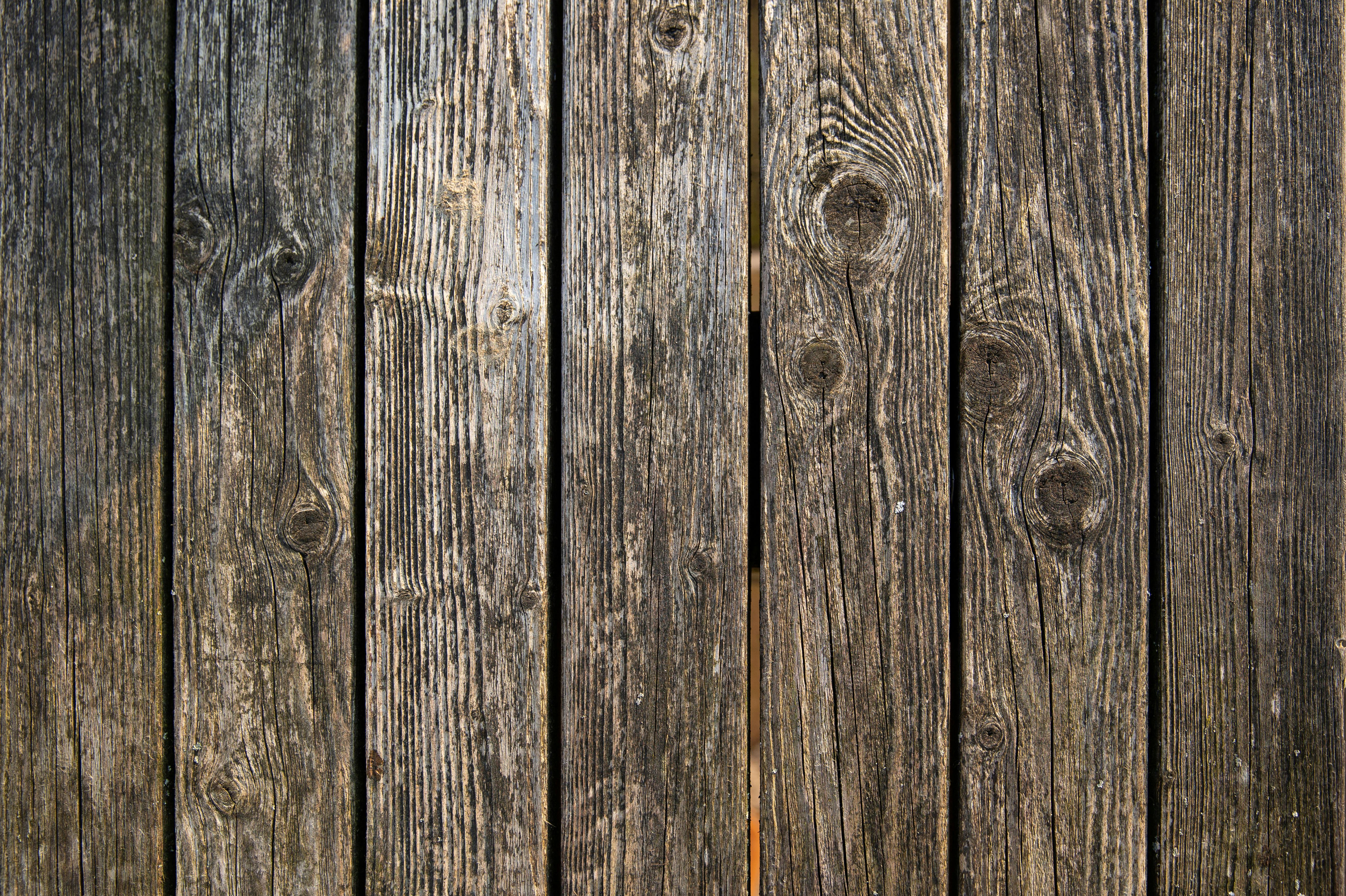Close-up of aged wood fence boards with visible grain and weathering, common in Memphis fences exposed to humidity and seasonal moisture.