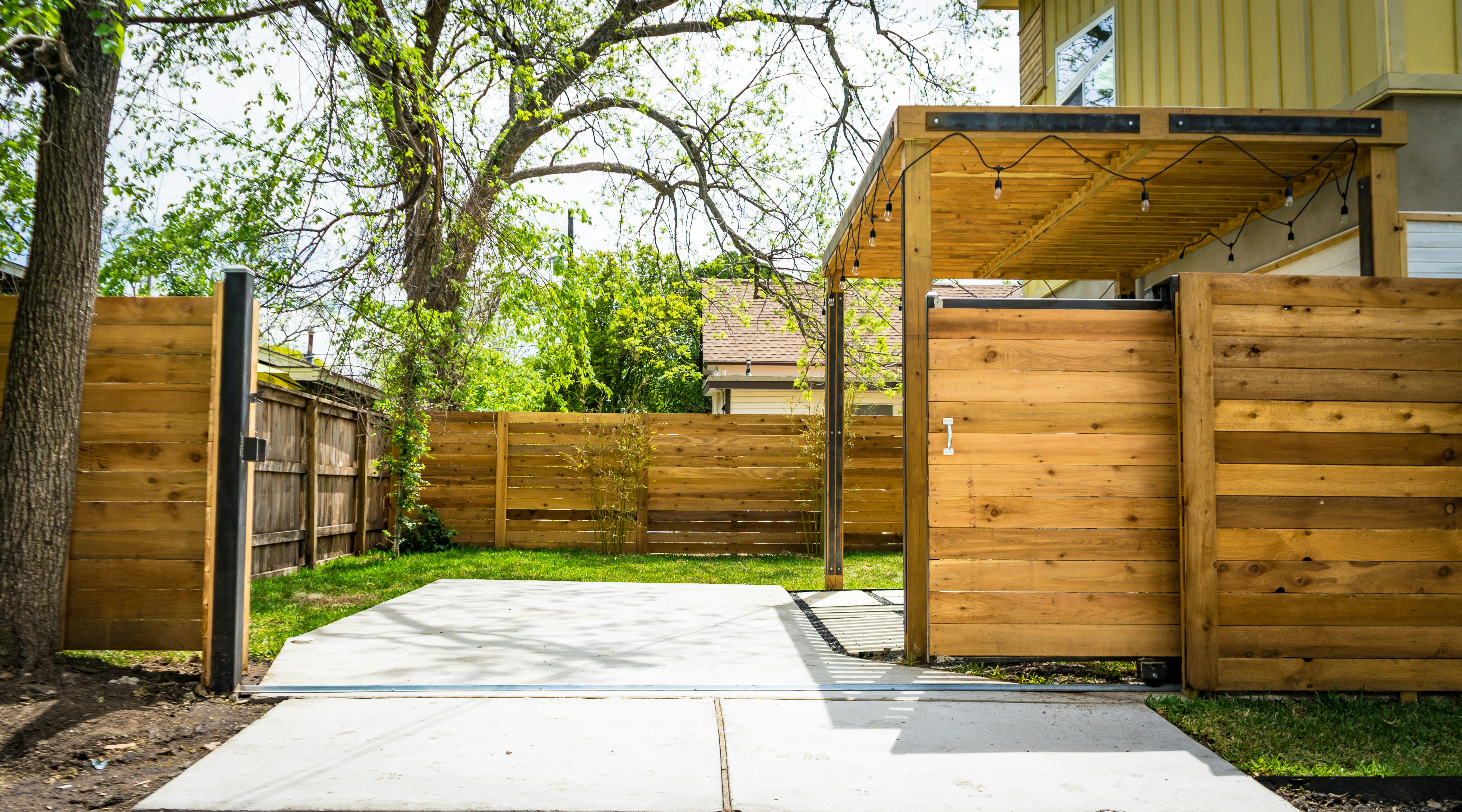 Newly installed cedar privacy fence and gate in a Memphis backyard, designed to handle humidity, rainfall, and soil movement common in West Tennessee.