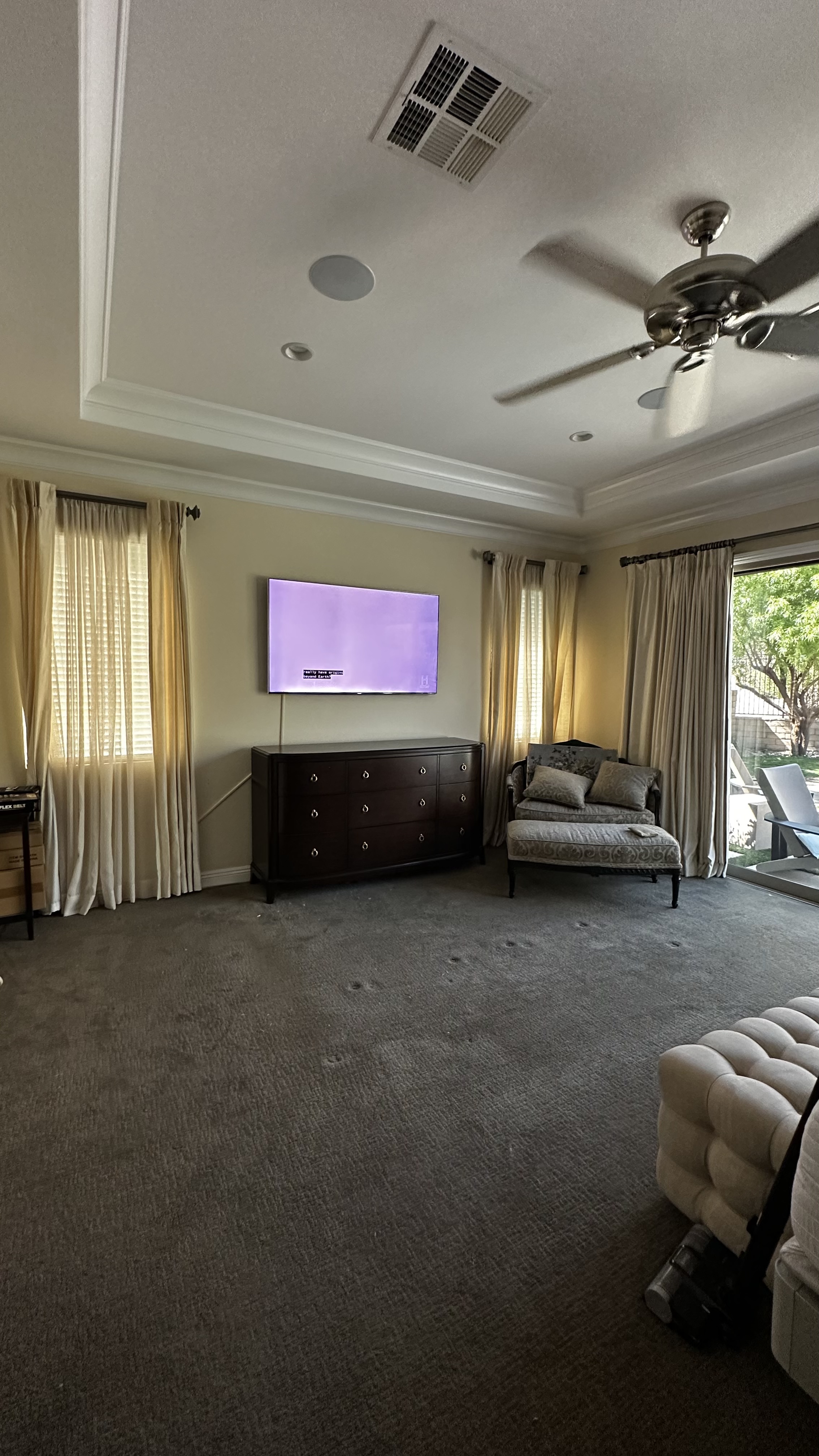 Urban intersection at Casino Center Blvd in Las Vegas with traffic lights, vehicles including a Tesla and Ford SUV, and tall buildings under overcast sky.