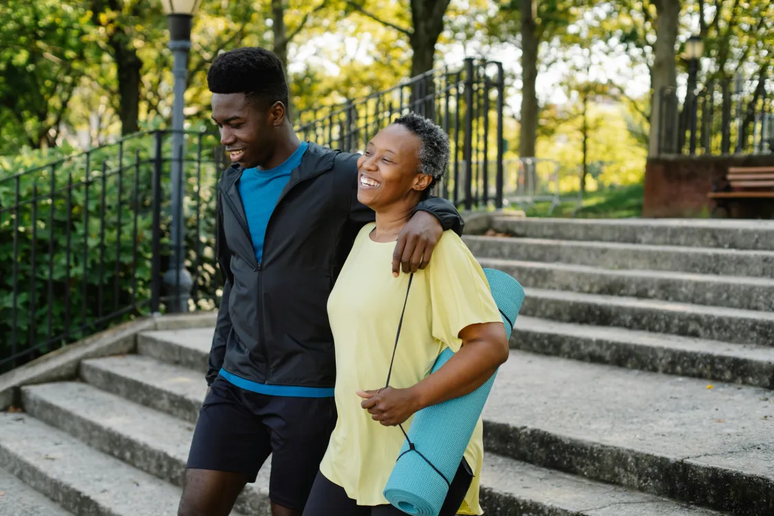 Community Events Calendar for June featuring arts, culture, wellness, and outdoor activities in New York City. Highlights include Friday Crafternoon at the New York Public Library, Met Escapes dementia-friendly discussions at The Met Cloisters, bilingual art workshops for individuals with memory loss at El Museo del Barrio, Bryant Park Bingo nights, chair yoga sessions, Open Streets on Columbus Avenue, and REVIVAL10 dance performances. The calendar also includes reminders about LGBTQ Pride Month celebrations and FIFA World Cup events happening in the NYC area.
