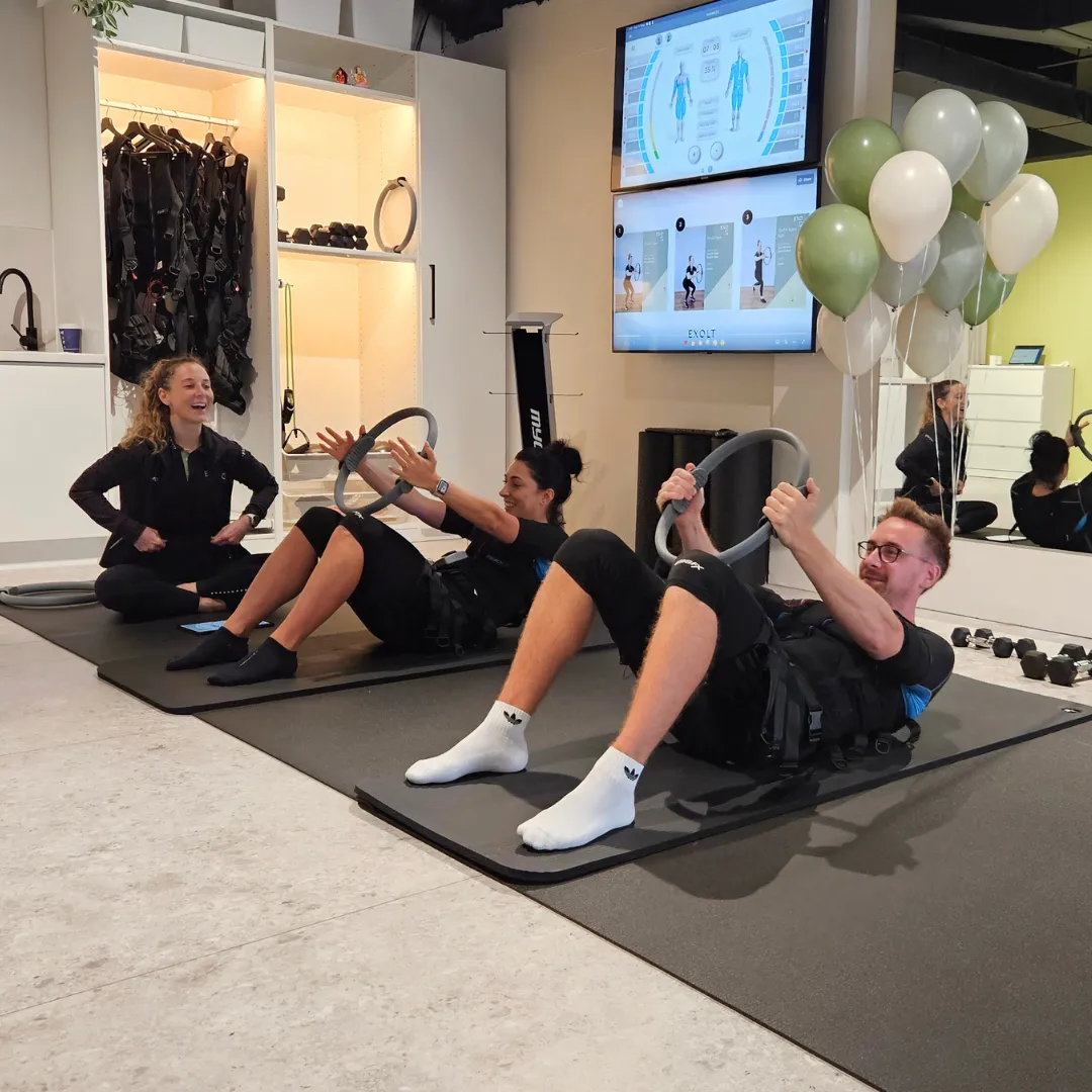 group of people in gym while exercising