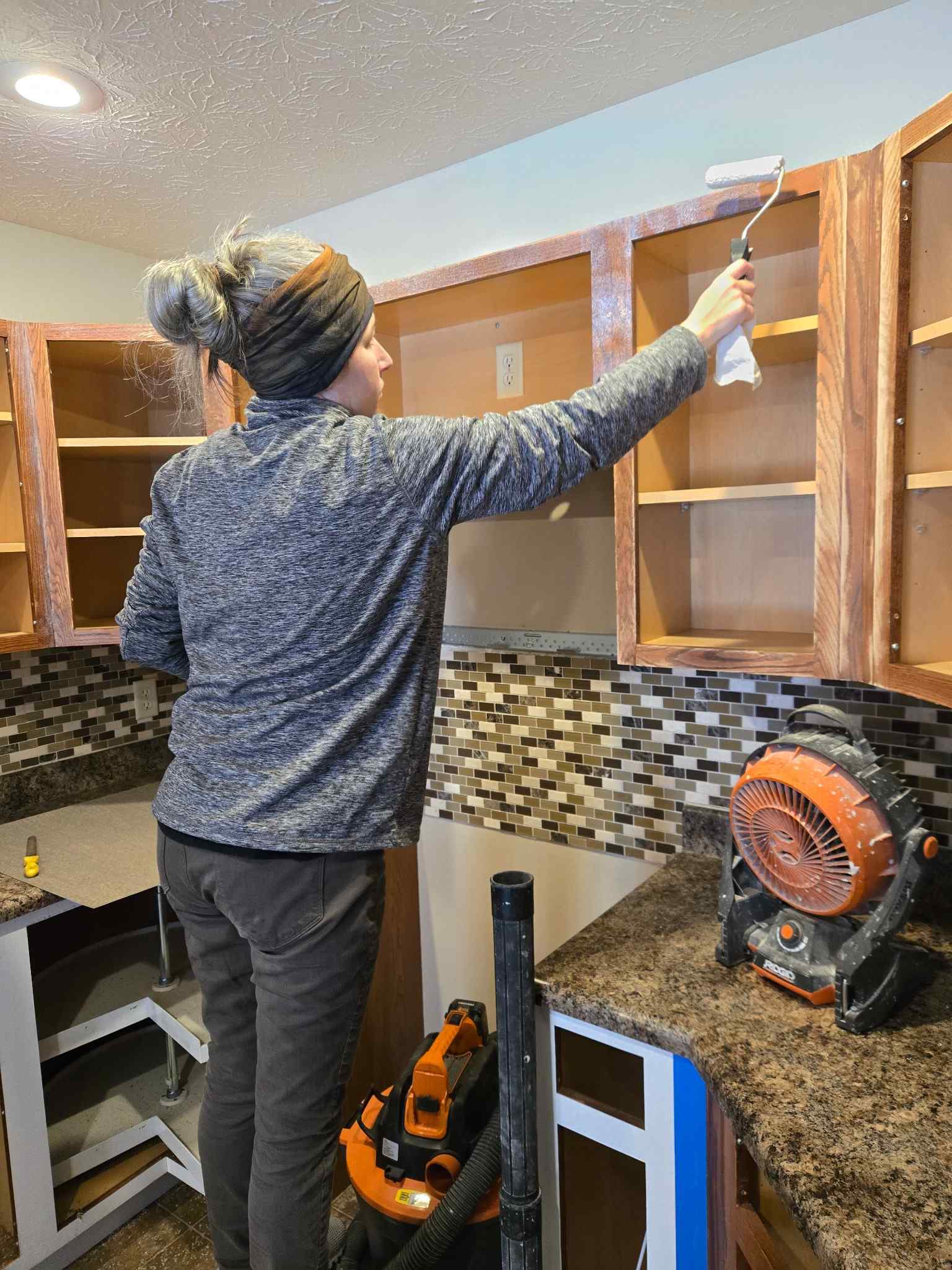 Maddie applying adhesive before lamination.