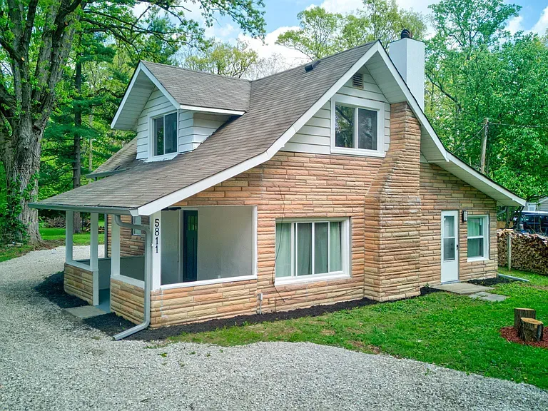 a rendering of a modern house with palm trees