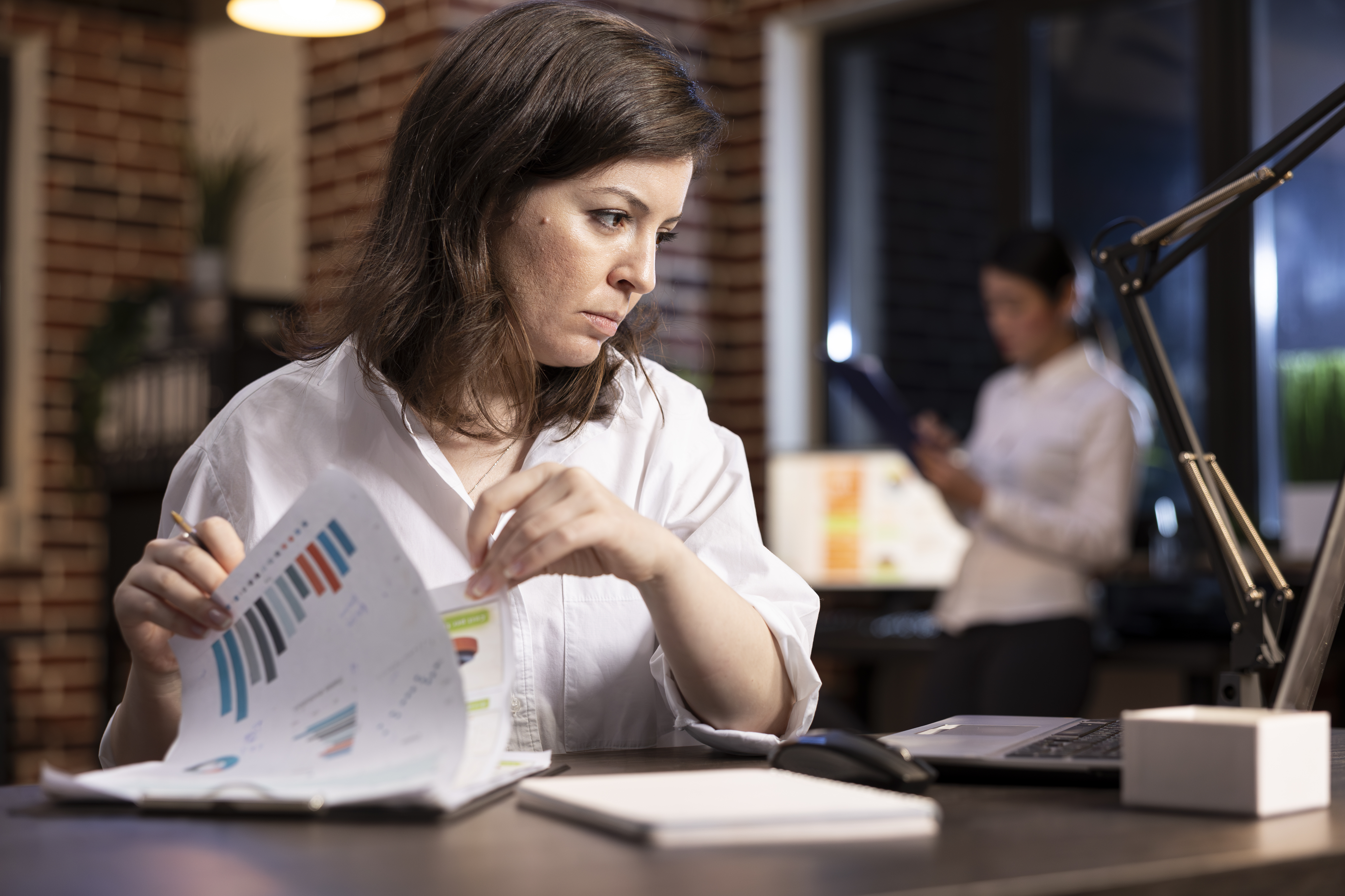Women checking a report