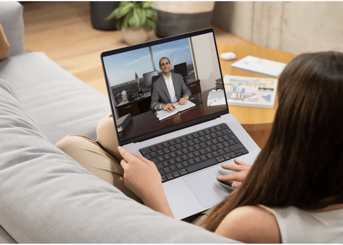 Woman watching an IRS Tax Relief video on her laptop from home
