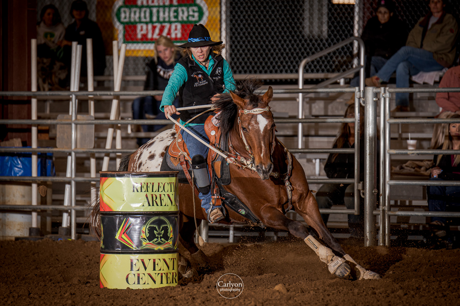 Placeholder - Wide dirt arena with barrel horse mid-turn for hero image