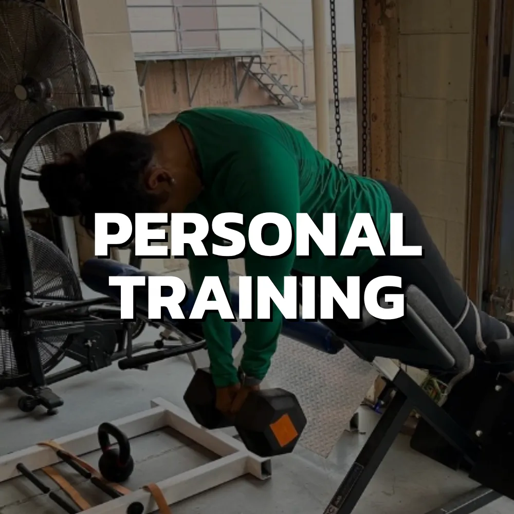 Personal training session in Cincinnati with coach guiding adult through strength workout in private gym