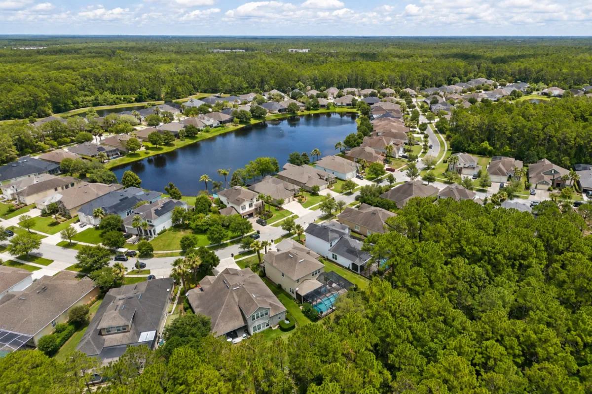 Aerial view of single-family homes, lake and preserve areas in Willowcove at Nocatee