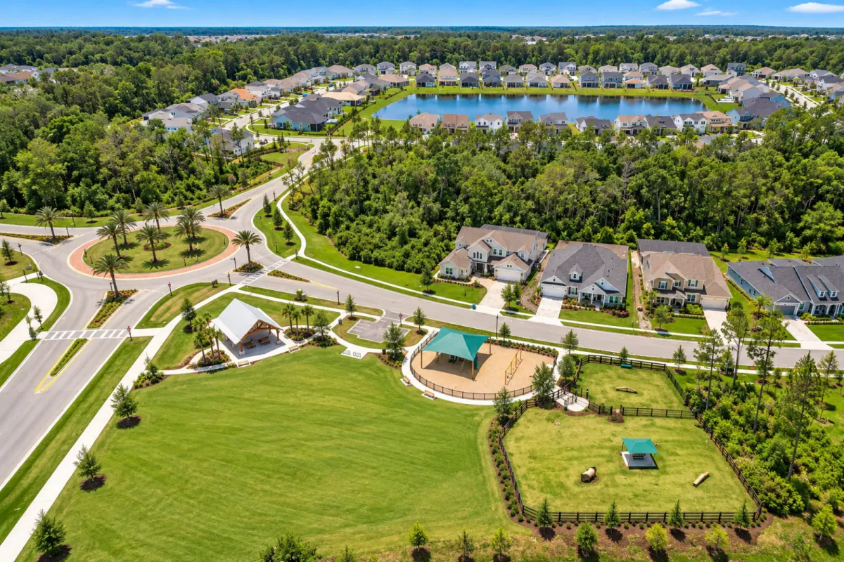Aerial view of The Junction at Twenty Mile showing homes, water and preserved woodland in Nocatee