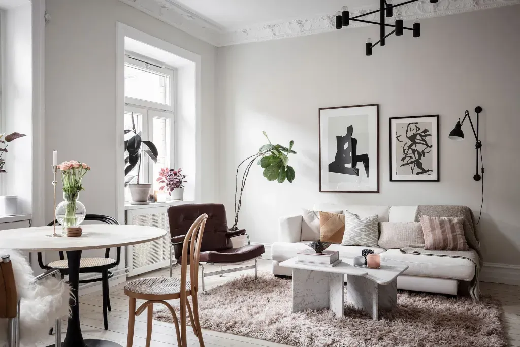 Minimalistic and cozy home interior with modern decor, soft neutral tones, and natural light, representing intentional living and creating a calming atmosphere.