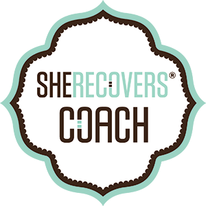 The SHE RECOVERS® Coach logo features a soft mint green background with a decorative white center outlined in a dark brown scalloped border. The text 'SHE RECOVERS' appears in modern uppercase font, with 'Coach' in bold brown letters below. A professional and inviting design symbolizing support for women in recovery.