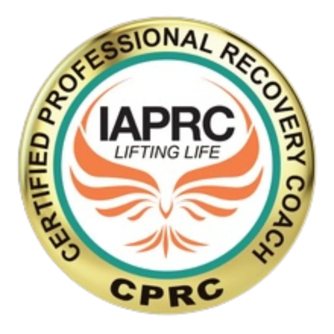 The Certified Professional Recovery Coach logo features a circular design with a gold outer ring containing the text 'Certified Professional Recovery Coach' and 'CPRC' in bold black letters. The inner circle showcases the IAPRC logo with the words 'Lifting Life' and an orange phoenix rising, symbolizing transformation and empowerment in recovery.